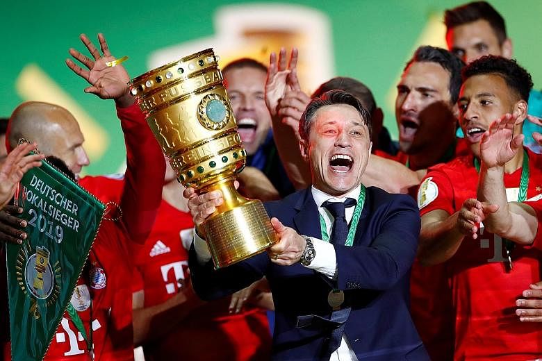 Bayern Munich coach Niko Kovac celebrating winning the German Cup with his players. There had been talk that he would be sacked even if the club did win the league and Cup double.