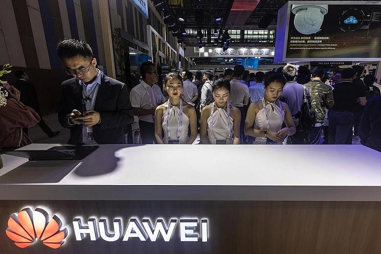 Huawei staff at an expo in Guiyang, China's Guizhou province, on Sunday. The country is in a separate digital universe to much of the rest of the world, and by cutting off Huawei, the US has taken a step that points towards a near-total tech split, s