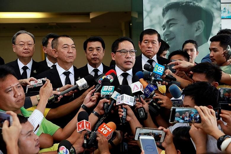 Palang Pracharath leader Uttama Savanayana speaking to reporters after a meeting with the Democrat Party leader yesterday at the Democrats' head office in Bangkok. The Democrats will meet today to discuss Palang Pracharath's offer, but the party is w