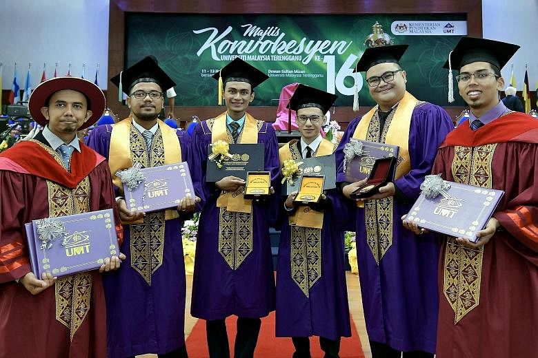 Graduates of Universiti Malaysia Terengganu at their convocation ceremony last November. Real starting monthly salaries for most fresh graduates have declined since 2010, says Bank Negara Malaysia. PHOTO: BERNAMA