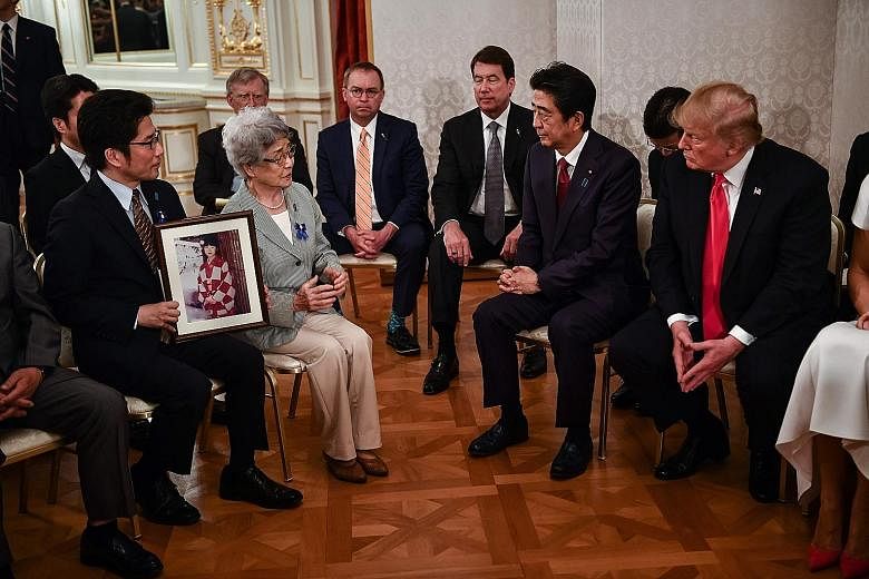 US President Donald Trump and Japanese Prime Minister Shinzo Abe meeting relatives of Japanese citizens who had been abducted by North Korean agents. Mr Abe has sought the support of world leaders including Mr Trump to raise the issue at their summit