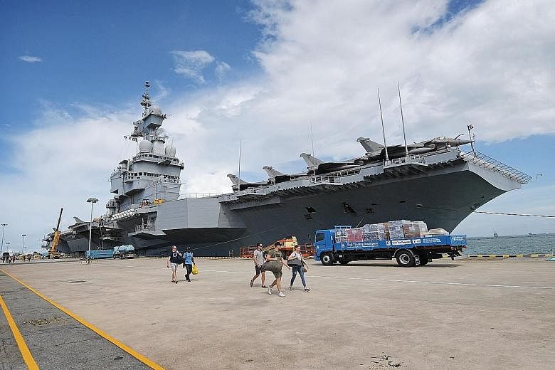 The Charles de Gaulle aircraft carrier at Changi Naval Base yesterday. It will carry out exercises with Singapore's navy and air force next week. ST PHOTO: ALPHONSUS CHERN