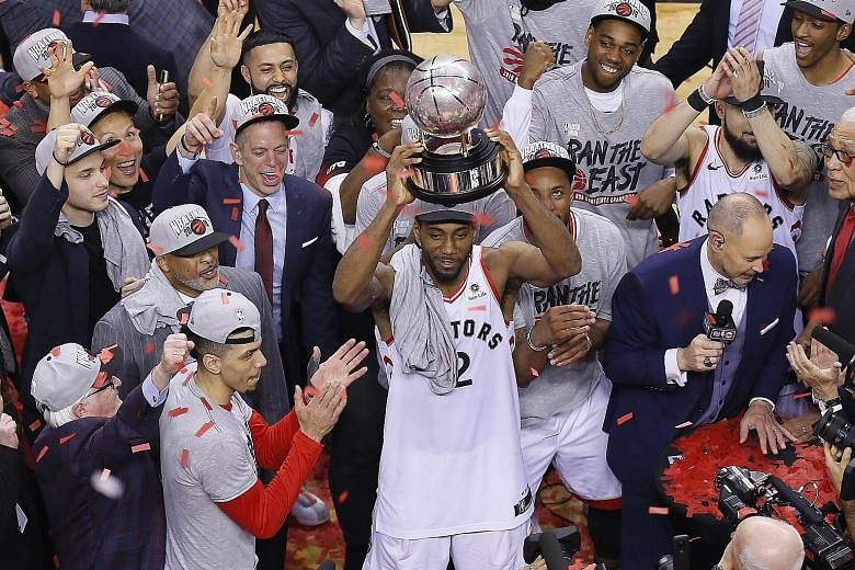 The Raptor's acquisition of forward Kawhi Leonard (holding the NBA Eastern Conference trophy) this season has been vindicated with Toronto now fighting to win their first NBA Finals in franchise history. PHOTO: REUTERS