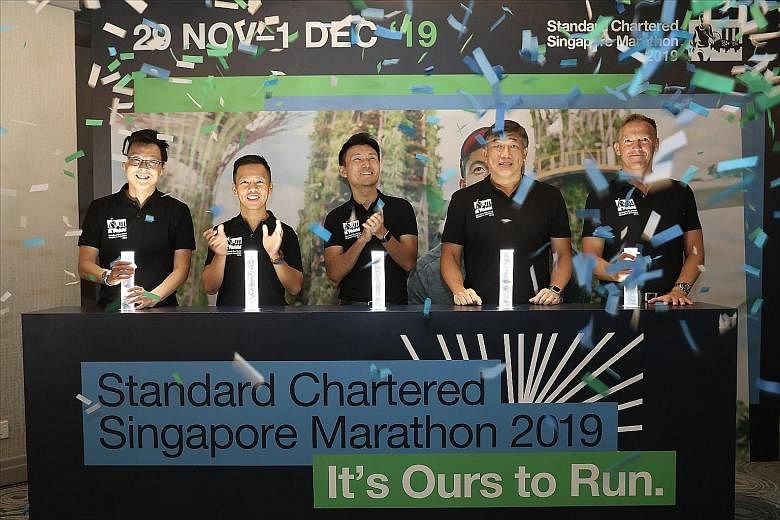 Senior Parliamentary Secretary for Transport, and Culture, Community and Youth Baey Yam Keng (centre) believes this year's evening flag-off will draw more people to cheer on the Standard Chartered Singapore Marathon runners and join in the excitement