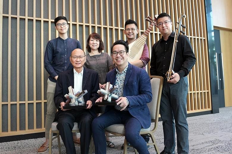 (Front row from far left) Historian Kua Bak Lim and Ding Yi Music Company's general manager and assistant conductor Dedric Wong. (Back row from far left) Ding Yi Music Company's marketing manager Tan Hong Ging, assistant general manager Sally Ng, pip