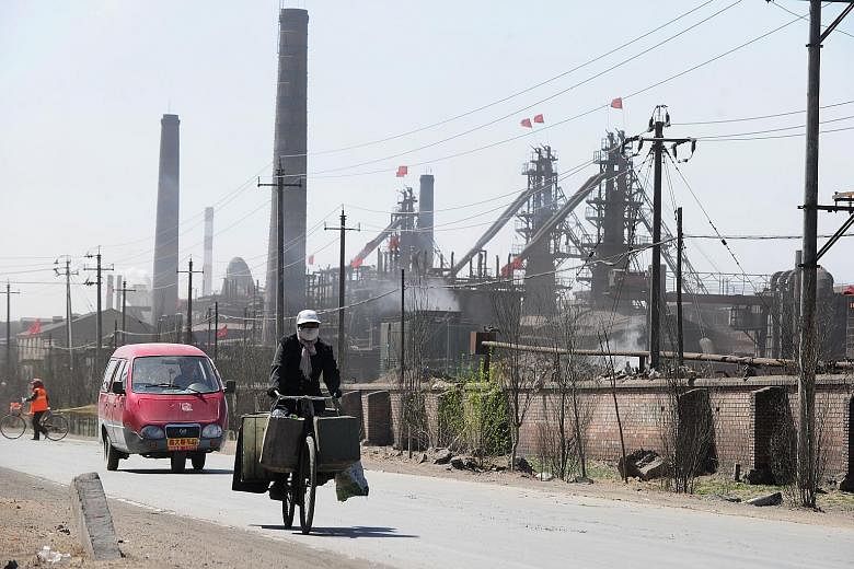 A road on the outskirts of Baotou city in Inner Mongolia, north-west China, where dozens of factories processing rare earths, iron and coal operate. China produced 120,000 tonnes of rare earth metals last year. Protesters in Kuala Lumpur last month u