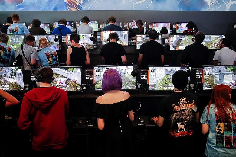 Gamers at the 2017 edition of gamescom in Cologne, Germany. Held there yearly since 2009, the festival is a highlight of the gaming world and the industry's largest event measured by exhibition space and visitor numbers. The Asian edition in Singapor