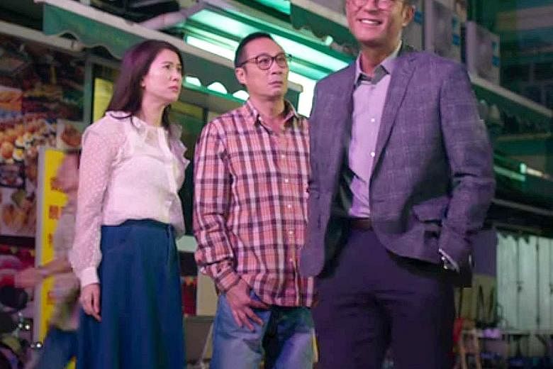 Mr Lo (Francis Ng, centre) and his wife (Anita Yuen, left) gets into a bureaucratic battle with a new neighbour (Louis Koo, right) when he erects a billboard that blocks their apartment's view of the sea.