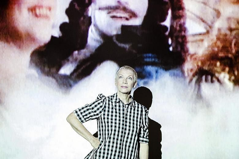 Annie Lennox in front of a video projection at her new installation art show, which reveals a personal side of the musician.