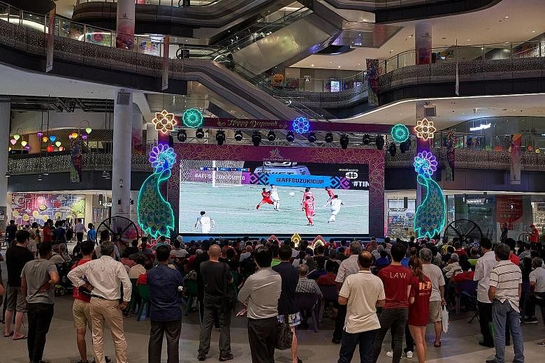 More than 1,000 fans turned up at Our Tampines Hub (OTH) in November last year to watch a live screening of Singapore's AFF Suzuki Cup group match with the Philippines. OTH will screen the Champions League final on Sunday morning. ST FILE PHOTO