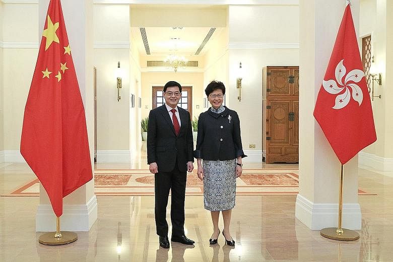 Deputy Prime Minister Heng Swee Keat met Hong Kong Chief Executive Carrie Lam yesterday. They said Singapore and Hong Kong have many common interests and cooperate well in areas such as education and finance. PHOTO: MINISTRY OF COMMUNICATIONS AND INF