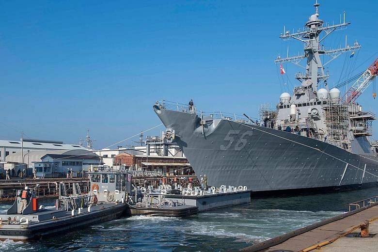 The guided missile destroyer USS John S. McCain in Japan. The Wall Street Journal reported that the White House wanted the US Navy to move the ship "out of sight" during President Donald Trump's recent visit to a site nearby.