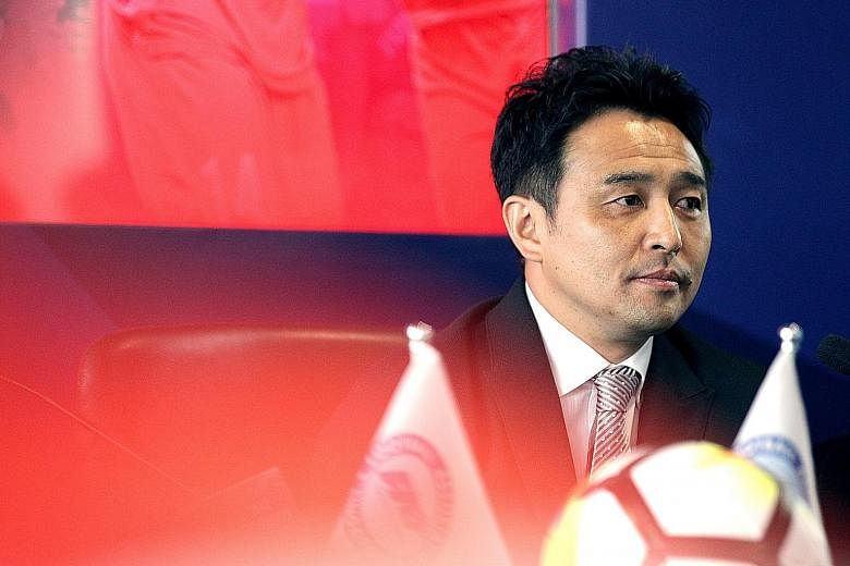 Tatsuma Yoshida, who was unveiled as the Singapore national coach yesterday, has vowed to work closely with his assistant Nazri Nasir and national Under-22 coach Fandi Ahmad. ST PHOTO: ZHANG XUAN