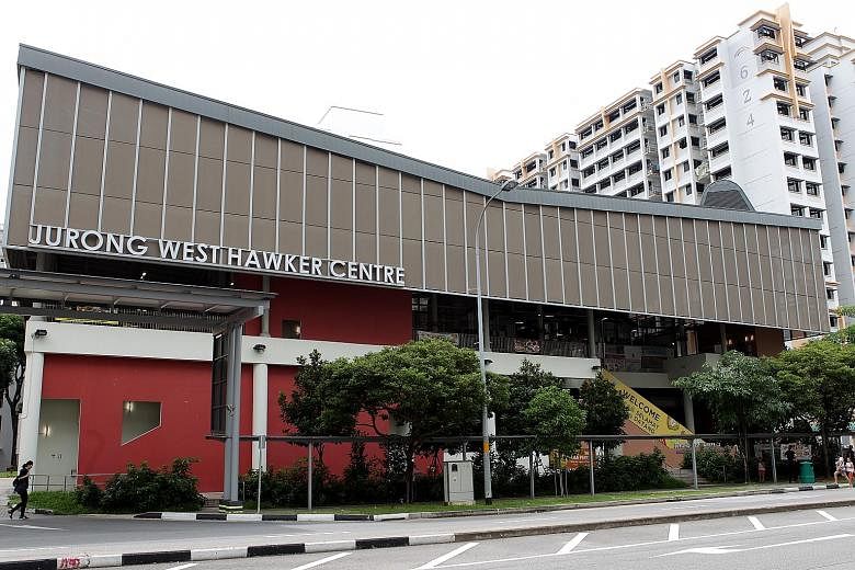 The sign on the facade of Jurong West Hawker Centre will be changed to read Jurong West Hawker Centre and Market to increase awareness of the existence of the wet market, and new signage will also help to direct visitors to the market. ST PHOTO: ZHAN