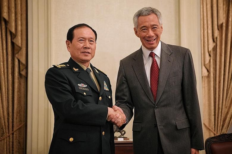 Chinese Defence Minister Wei Fenghe meeting Prime Minister Lee Hsien Loong at the Istana yesterday. They affirmed the longstanding, warm and friendly bilateral relations between Singapore and China, which have progressed steadily over the years, said