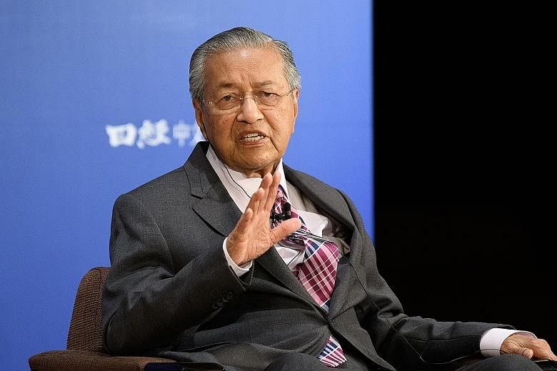 Malaysian Prime Minister Mahathir Mohamad, speaking at the 25th Nikkei Future of Asia conference in Tokyo yesterday, cited the South China Sea as a major regional flashpoint. PHOTO: BLOOMBERG