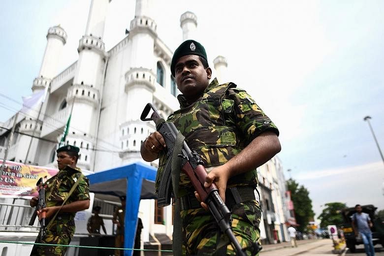 Soldiers guarding a mosque in Colombo, Sri Lanka. The country has been under a state of emergency since the Easter bombings, but this is expected to end within a month as the situation returns to normal. PHOTO: AGENCE FRANCE-PRESSE
