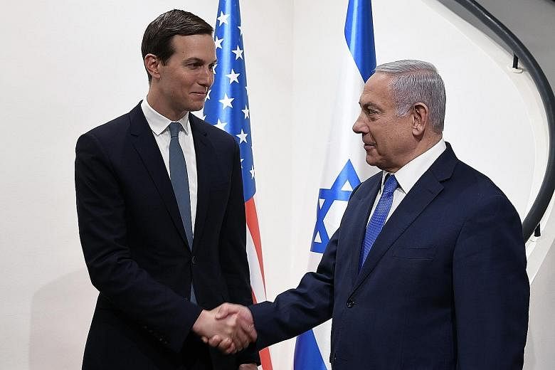 US President Donald Trump's son-in-law and aide Jared Kushner (left) meeting Israeli Prime Minister Benjamin Netanyahu yesterday. PHOTO: EPA-EFE