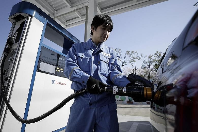 A hydrogen pump attendant at the Kawasaki Hydrogen Station, operated by Air Liquide, in Japan's Kanagawa prefecture.