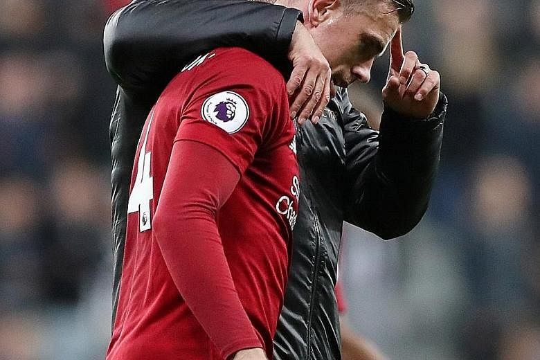 Liverpool manager Jurgen Klopp and Jordan Henderson, his captain and workhorse. The Reds and Tottenham have harnessed English football's traditional strengths, energy and never-say-die spirit, with great success. PHOTO: REUTERS