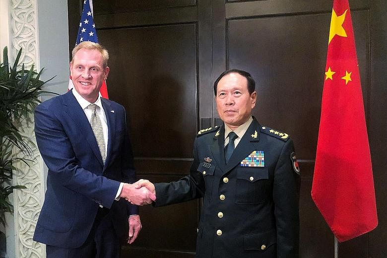 US Acting Defence Secretary Patrick Shanahan and Chinese Defence Minister Wei Fenghe meeting on the sidelines of the Shangri-La Dialogue yesterday.