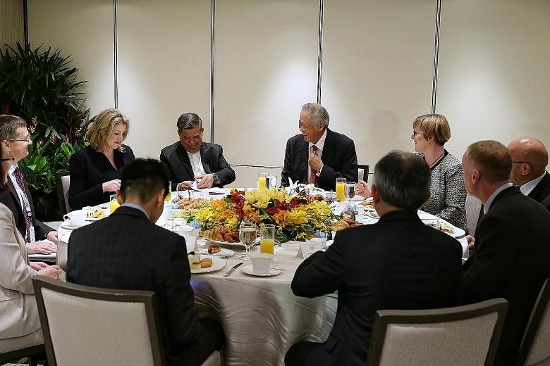 Singapore's Defence Minister Ng Eng Hen (centre) having breakfast with his counterparts from the Five Power Defence Arrangements (FPDA) member nations - (from left) Ms Penny Mordaunt of the United Kingdom, Mr Mohamad Sabu of Malaysia, Ms Linda Reynol