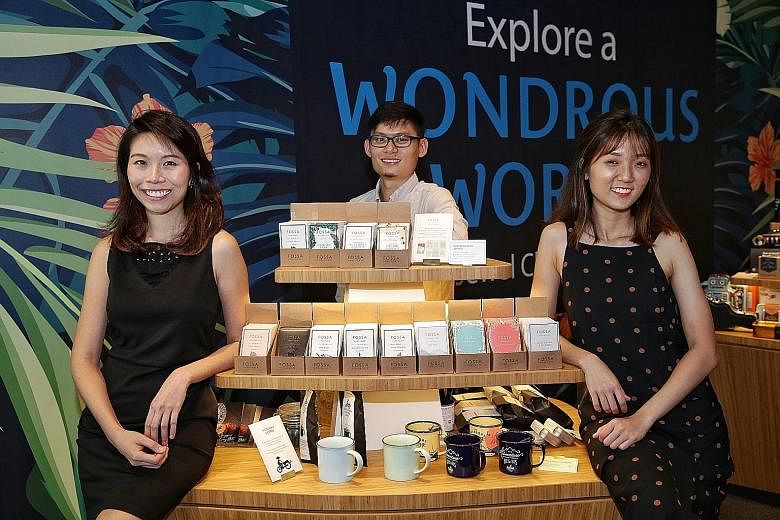 Fossa Chocolate founders (from left) Yilina Leong, 28, Jay Chua, 31, and Charis Chia, 25, with their products at Gift by Changi Airport at Jewel Changi Airport. Mr Ho Mun Choon, 23, a retail assistant, with a sealed packet of red bean pastry from Ton