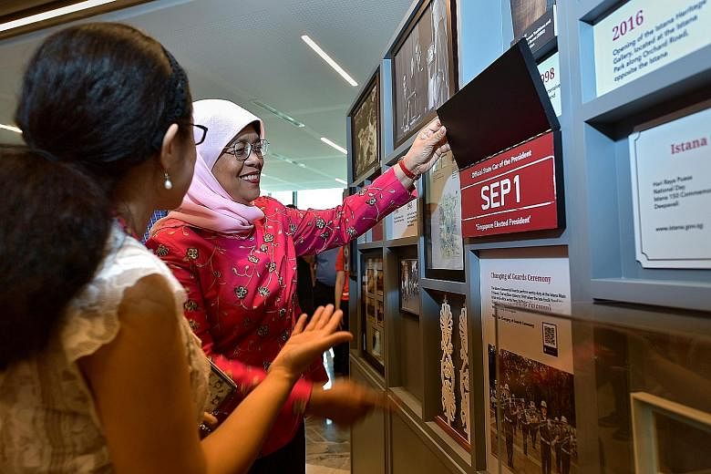 President Halimah Yacob at the roving exhibition, Our Istana: A Living Museum, which was launched at the Tampines Regional Library yesterday. ST PHOTO: NG SOR LUAN