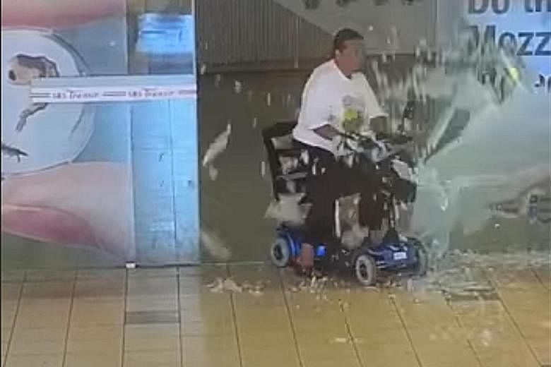 Screen grabs of a video posted on SBS Transit's Facebook page show the rider hitting one of a pair of glass doors at Toa Payoh bus interchange before they can fully open. She then appears to wheel the scooter away.