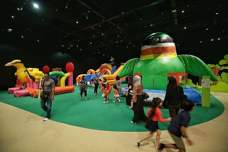 Kids can play on three bouncy castles shaped like birds at the Forest Playground at the National Museum of Singapore.