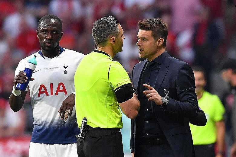 Tottenham manager Mauricio Pochettino appealing to referee Damir Skomina as a worried Moussa Sissoko awaits in vain. The Spurs midfielder was adjudged to have handled in the box 23 seconds after kick-off. Liverpool went on to win 2-0.