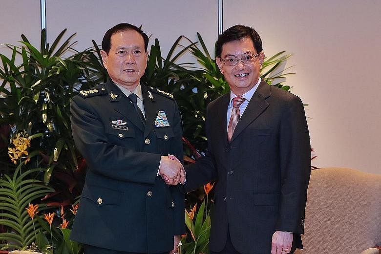 Chinese Defence Minister and State Councillor Wei Fenghe met Deputy Prime Minister Heng Swee Keat on the sidelines of the Shangri-La Dialogue yesterday. General Wei, who is also on an introductory visit to Singapore, congratulated Mr Heng on his new 