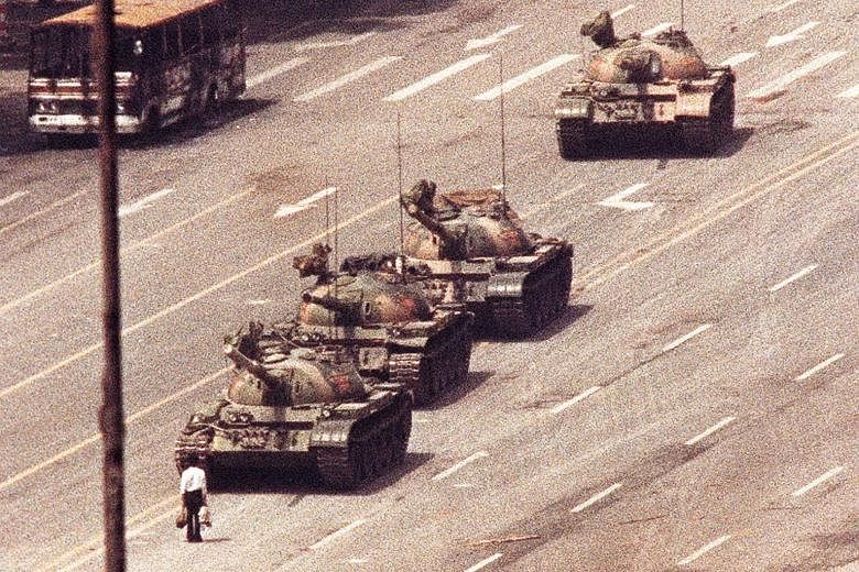 An unidentified man, who later became known as Tank Man, blocking a column of tanks in Beijing's Avenue of Eternal Peace on June 5, 1989.