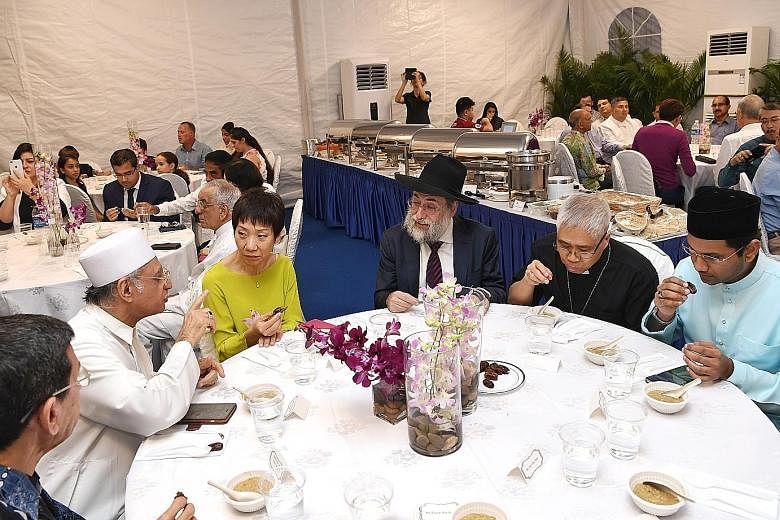 Present at the break-fast session are (from left) Muis president Mohammad Alami Musa, Imam Habib Hassan Al-Attas, Minister for Culture, Community and Youth Grace Fu, Chief Rabbi of Singapore Mordechai Abergel, Archbishop William Goh Seng Chye and Nom