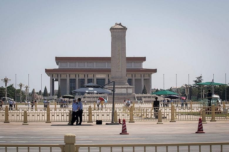 Police officers keeping watch over Tiananmen Square in Beijing yesterday, ahead of the 30th anniversary of the crackdown today. While the incident cannot be commemorated publicly in mainland China, events marking its anniversary have been planned in 