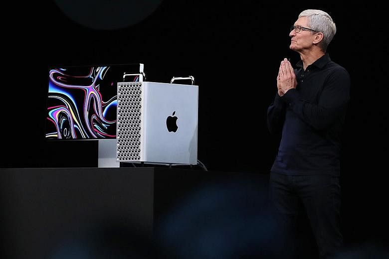 Apple CEO Tim Cook unveiling the new Mac Pro at the Worldwide Developers Conference on Monday. PHOTO: AGENCE FRANCE-PRESSE