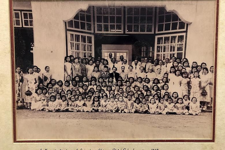 Above: An undated archive image of Singapore Chinese Girls' School staff and pupils outside the Primary School Block, which was completed in 1925. Below: Staff and students of SCGS, circa 1948.