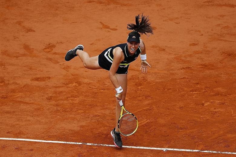Johanna Konta serving to American Sloane Stephens in their French Open quarter-final yesterday. She won 6-1, 6-4 to become the first British semi-finalist since 1983.