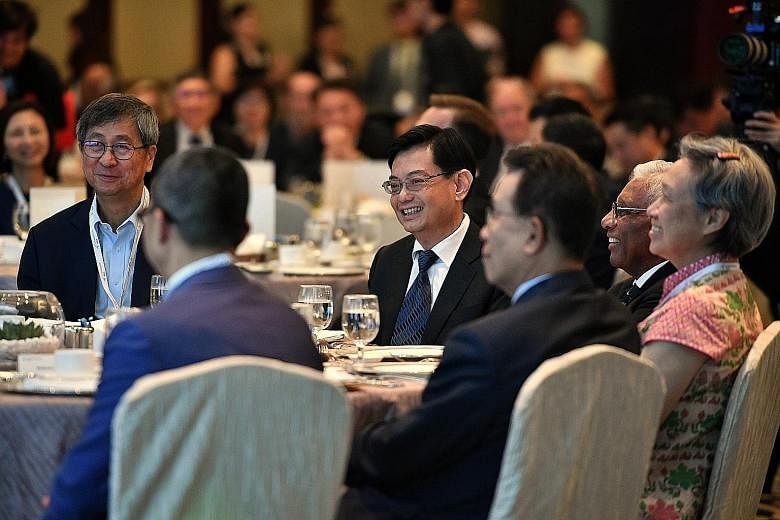 Temasek chairman Lim Boon Heng (from left), Deputy Prime Minister Heng Swee Keat, Temasek Trust board of trustees chairman and Council of Presidential Advisers member S. Dhanabalan, and Temasek executive director and chief executive Ho Ching at the S