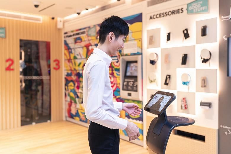 Singtel's first unmanned pop-up store at 20 Pickering Street has no shop assistants, but customers are greeted by a service staff member via a video screen on a roving robot. It is a self-service store that allows customers to try out phones, sign up