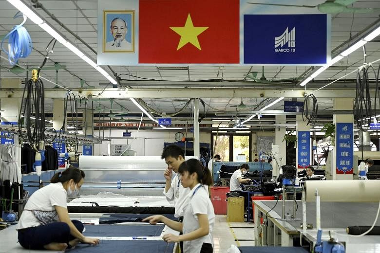 Garment workers in a Hanoi factory. Vietnam has gained orders from trade diversion on tariffed goods equal to 7.9 per cent of gross domestic product in the year through the first quarter of 2019, says a study.
