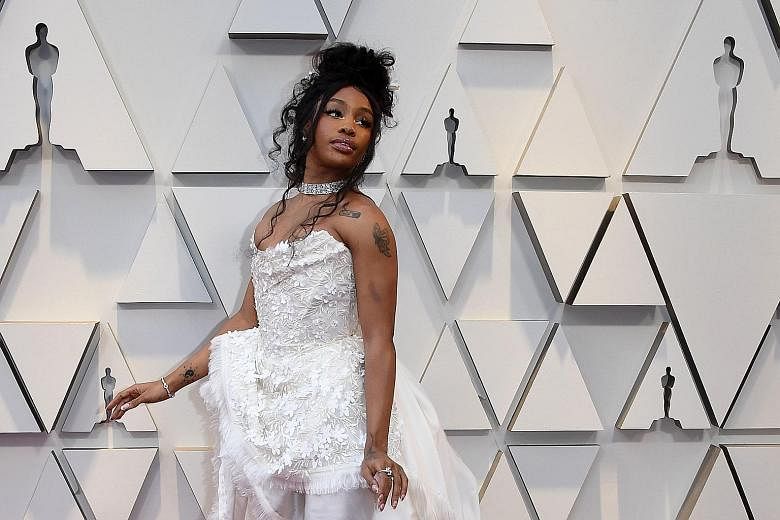 Sephora has apologised to R&B star SZA (above) after she said a store employee in California "called security to make sure I wasn't stealing".