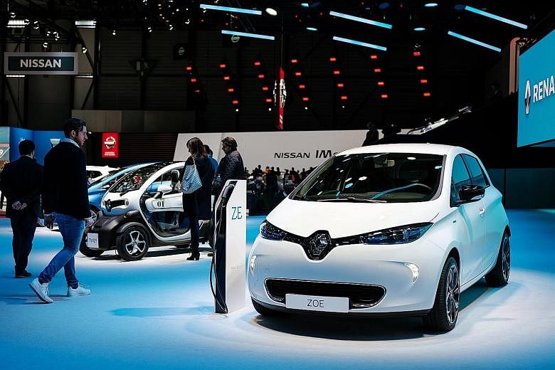 Renault's battery-powered subcompact Zoe on display at the Geneva International Motor Show last month. Fiat Chrysler and Renault told investors a merger would cut operating costs and investments by €5 billion or more a year. It is not clear what th