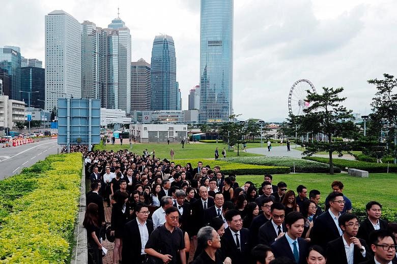 Almost 3,000 legal professionals in black garb staged a silent protest at the Court of Final Appeal in Hong Kong yesterday, demanding that the authorities scrap a proposed extradition Bill, with less than a week before it is tabled at a full Legislat