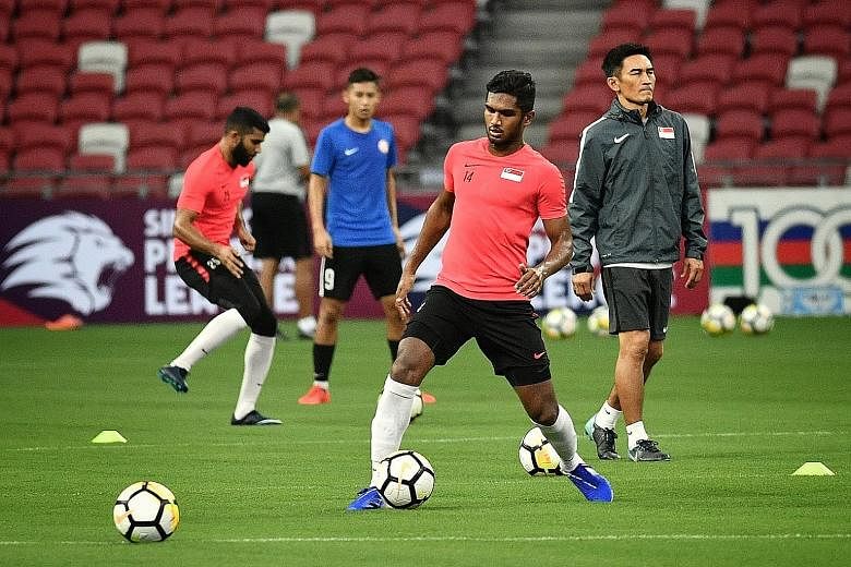 The Lions training at the National Stadium before their friendly against the Solomon Islands tonight. ST PHOTO: CHONG JUN LIANG