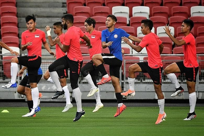 The Lions being put through their paces at the National Stadium yesterday. Coach Tatsuma Yoshida admits there is "not enough time" to implement his ideas, but captain Hariss Harun has noticed subtle changes.