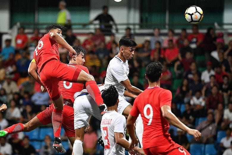 Irfan Fandi (far left) putting Singapore 2-0 up in the Merlion Cup game against the Philippines at Jalan Besar Stadium yesterday.