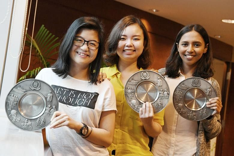 Part-time food delivery rider Muhammad Talip Ajman Ali chased after a man suspected of stealing a mobile phone near Lower Delta Road and helped in his arrest. The Fullerton Bay Hotel's Ms Maria Leong (far left) with rooms division manager Rhea Maria 
