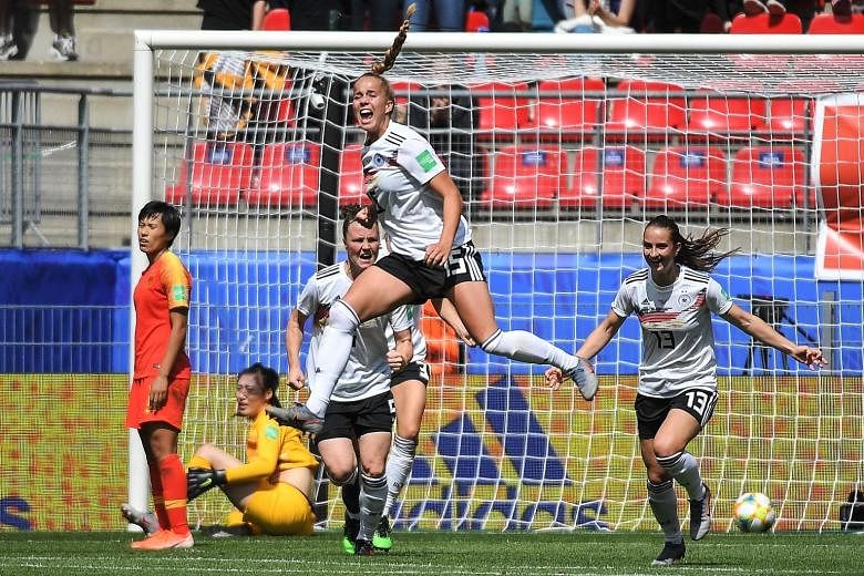 Germany's midfielder Giulia Gwinn jumps for joy after scoring the winner in their Women's World Cup Group B match against China yesterday.