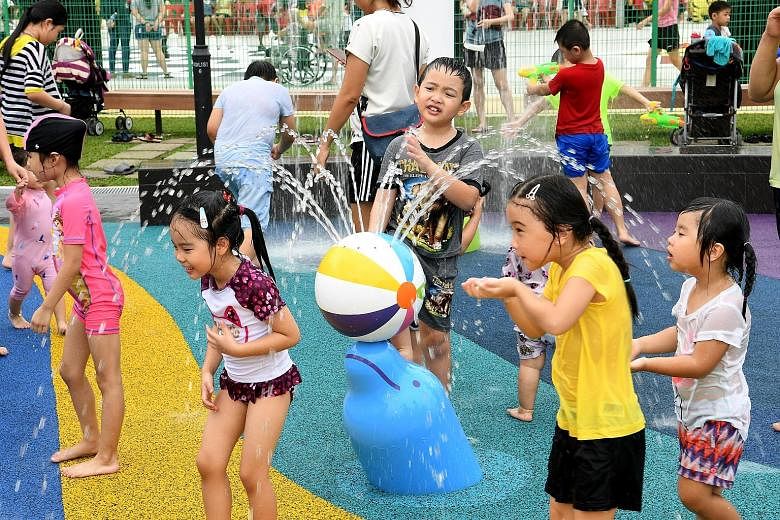 Children enjoying the water play zones at Oasis Waterpark @ Nee Soon East after its launch yesterday.